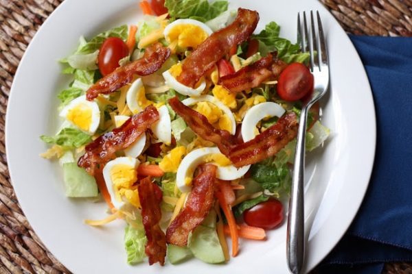 Thai style salad with bacon and egg.